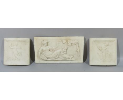 A central rectangular marble tile carved with a recumbent Aphrodite toying with a putti flanked by two further marble tiles o