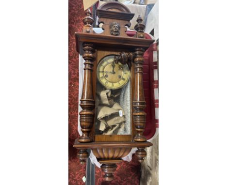 A small walnut cased Vienna regulator wall clock. 