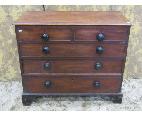A 19th century mahogany and stained pine sided bedroom chest of three long and two short drawers set on bracket feet, 82cm hi