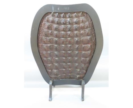 A Vintage fire screen with crocodile hide covering, 72cm x 35cm