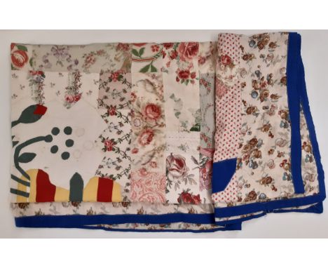 An unusual patchwork panel composed of a central vase of flowers motif in applique, surrounded by vintage cotton print patche