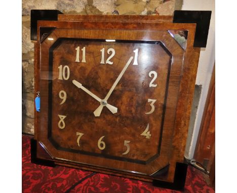 A large wall clock in the Art Deco style, veneered in burr walnut with further walnut banding, of stepped squared form with c