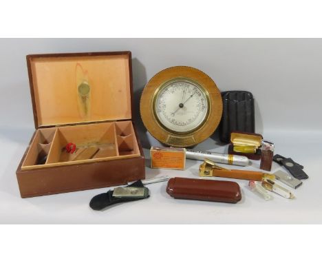 A Thomas Armstrong Barometer, together with a leather cigar box containing cigar cutters, leather cigar pouch, an amber and g