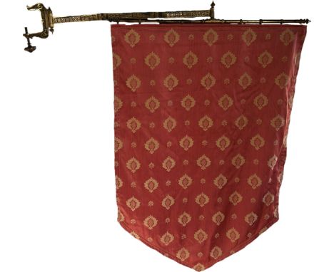 A brass engraved Egyptian vase, Victorian banner on a brass adjustable bracket and an urn shaped marble lamp on rams head sup
