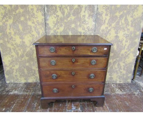 A small Georgian mahogany and oak lined chest of four drawers on bracket supports, 77cm wide