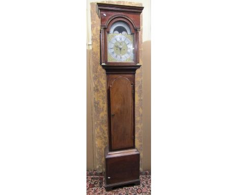 A Georgian mahogany longcase clock the hood enclosing a broken arch dial with silvered chapter ring, the arch enclosing a lun