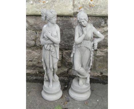 Two small cast composition stone garden/interior ornaments in the form of  standing classical maidens in varying pose, 64 cm 