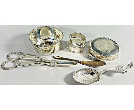A selection of silver to include an ashtray, candle snips, fish knife, bowl, a pair of napkin ring, and a continental decorat