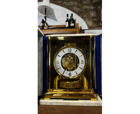 Jaeger-LeCoultre, An ‘Atmos’ table clock, of typical design with gilt brass frame, 22cm high, 18 x 12cm, movement housing num