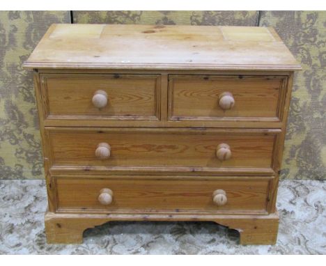 Small stripped pine bedroom chest of two long and two short drawers, raised on bracket supports, 70cm high x 83 x 43