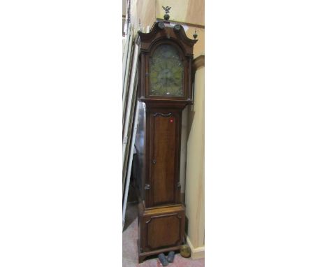 A Georgian oak longcase clock by James Evans of Shropshire with eight day movement, the broken arch brass dial with engraved 