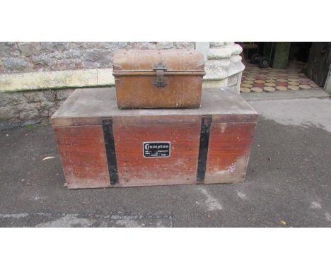 A teak and steel banded trunk with applied label Crompton, with plywood lid, together with a small tin trunk (2)