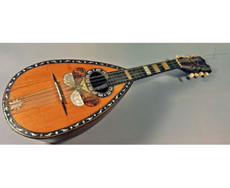 An old mandolin with an overlaid butterfly and mother of pearl inlay (as found) 