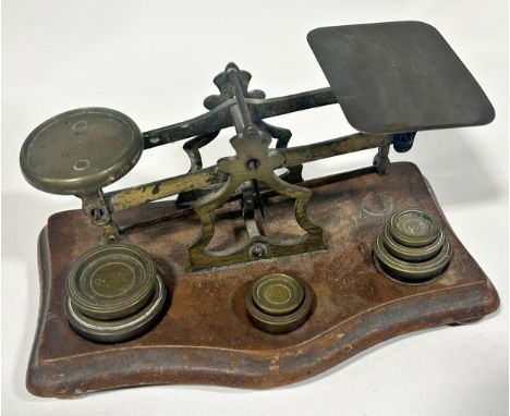 A set of Victorian balance postal scales together with a collection of brass weights 