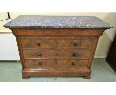 19th century mahogany commode of four long drawers with well matched flame veneers, beneath a marble top 94cm high x 128cm x 