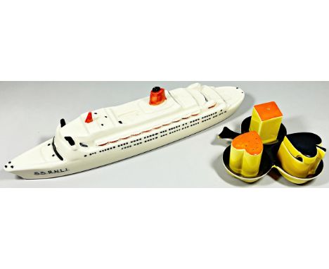 A Carltonware porcelain model of a ship, ‘S.S R.N.L.I’, 37cm long and a novelty Carltonware playing card suit cruet set.