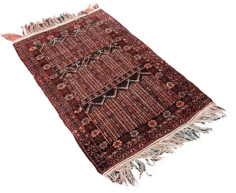 A small Afghan prayer mat with geometric panels and floral surround, 140cm x 90cm approximately