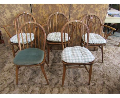 Five vintage Windsor style stick back chairs including three carvers 
