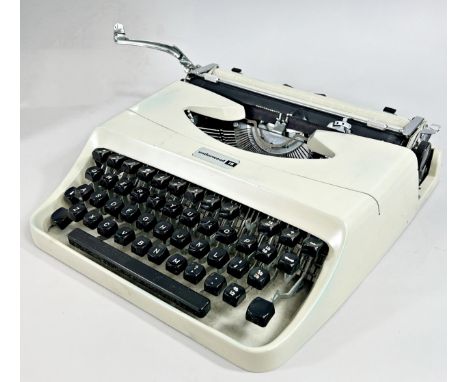 A Retro Underwood portable typewriter in it’s original leatherette carry case. 