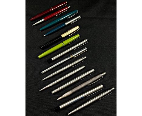 A mixed collection of vintage Parker and other fountain and ballpoint writing pens to include a machined silver example etc (