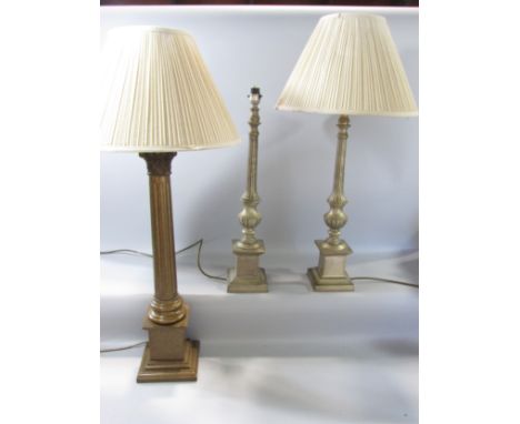 A single Corinthian column table lamp and a pair of candlestick column table lamps and shades, each approximately 60 cm high.