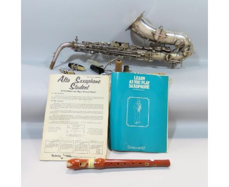 A Martin low pitch saxophone serial No 46726 housed in a Tempo Music Shop Alameda California case, together with a wooden rec