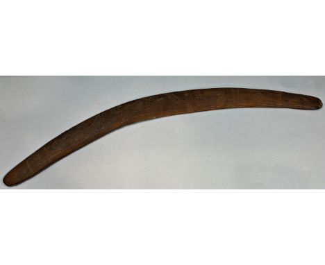 An old Australian aboriginal Mulga wood boomerang with stone cut decoration 