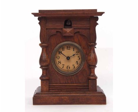 Unusual early 20th century cuckoo clock, plinth shaped case with overhanging cornice and half baluster turned columns and pli