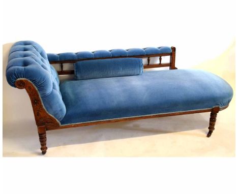 Late Victorian chaise longue with galleried back, upholstered in blue button back on ring turned legs, 180cms long  