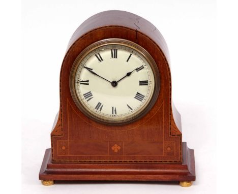 Mid-20th century mahogany and boxwood line inlaid mantel timepiece, the arched case on shaped pediment and raised on compress