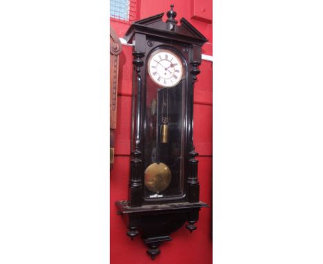 Late 19th century ebonised Vienna type timepiece, the case with overhanging cornice surmounted by a break-arch pediment with 