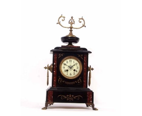 Late 19th century French black and variegated rouge marble mounted mantel clock, the plinth shaped case surmounted by a shall