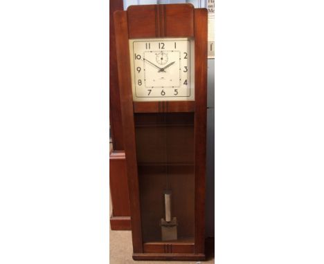 Mid-20th century oak cased electric timepiece, IBM - International, the plinth shaped case with panelled and glazed door with