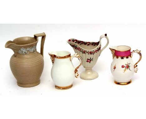 Group of four porcelain jugs, one with a mask spout and mask to handle, the second in similar fashioned Copeland, late 19th c