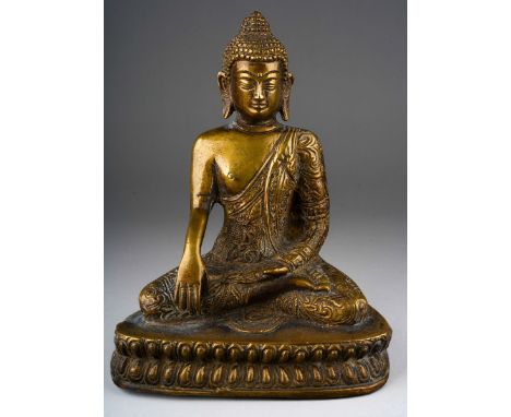 A gilt bronze seated buddha 