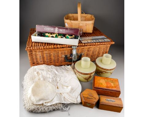 A wicker picnic hamper of collectable items, including a pair of vintage glass light shades, three various treen boxes, an em