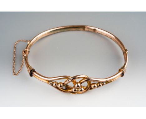 An early 20th century 9ct gold hinged bangle, bangle damaged, bangle unmarked, gross weight of bangle 6.1 grams.