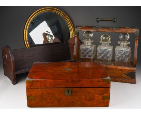 A box of treen etc comprising a late Victorian oak three-bottle tantalus, a circular gilt-framed mirror, a 1920's table-top b