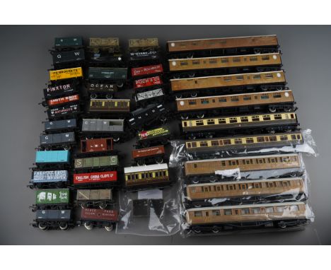 Box of assorted OO Gauge loose wagons and coaches by Hornby, Bachmann etc