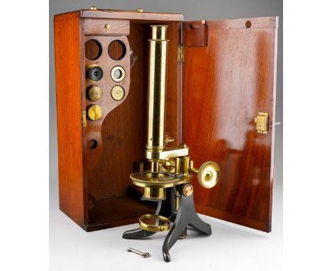 A 19th century mahogany cased brass compound microscope, unmarked, height 39.5cm, the case is fitted with a drawer containing