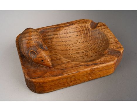 A John "Mouseman" Thompson oak ashtray, the shaped rectangular ashtray with dished centre and carved with signature mouse to 