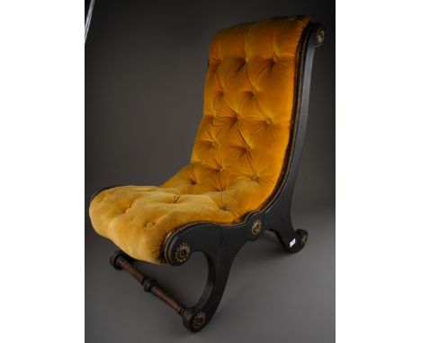 A Regency style ebonised and gilt metal slipper chair, with button back gold velvet upholstery, the frame applied with gilt m