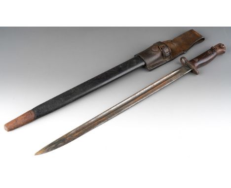 An early 20th century Vickers bayonet, the steel blade with crown stamp GR over1907, various other marks stamped verso on bla