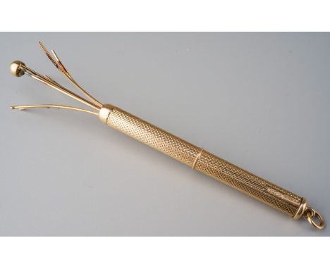 A late 1960s 9ct gold swizzle stick, with engine turned surface detail. Sponsors mark SJR, hallmarked 9ct gold Birmingham, 19