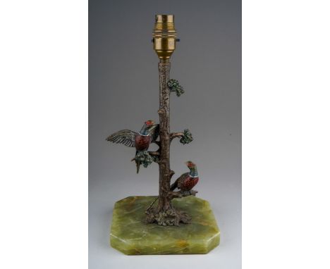 A cold painted bronze lamp base cast as two pheasants in a tree, mounted on a rectangular green onyx base, remnants of a silv