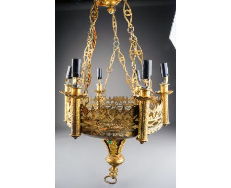 A Gothic Revival six light gilt metal chandelier, the lights above pierced gallery rail, applied with flowers with cabochon a
