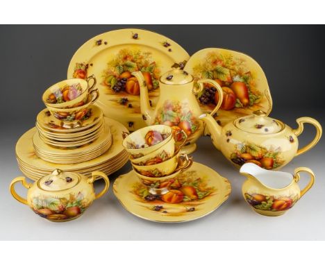 An Aynsley Orchard Gold part dinner service, all seconds, comprising an oval meat plate, six dinner plates, teapot and cover,