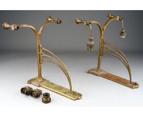 A pair of early 20th Century twin branch brass bracket light fittings 