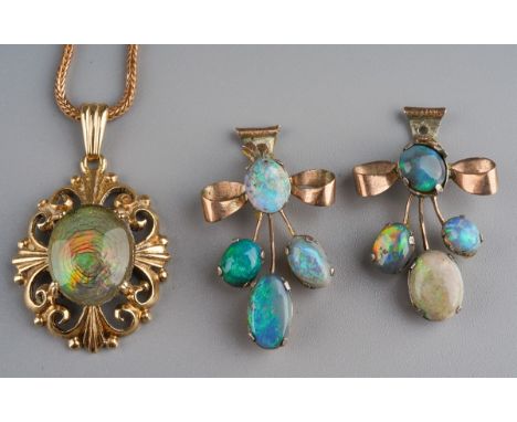 A 9ct gold opal triplet necklace and a pair of yellow metal earring components, the necklace designed as an opal triplet (dam