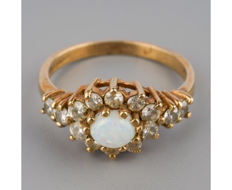 A 9ct gold opal and cubic zirconia dress ring, hallmarked 9ct gold, stamped cz, ring size L, weight 2.4 grams.